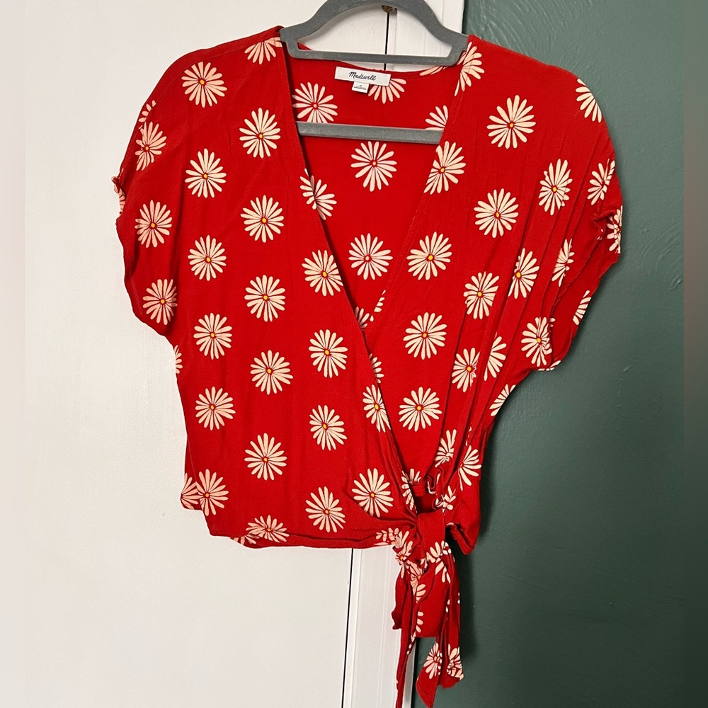 Light and airy Madewell wrap top with snaps and adorable floral pattern.